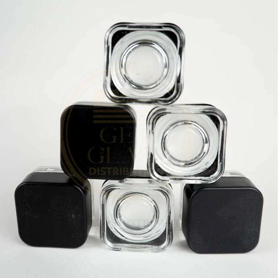 Shop Clear Glass Dab Jars with Black Cap in bulk—airtight, durable storage for concentrates. Perfect for cannabis accessories wholesale and smoking supply distributors.