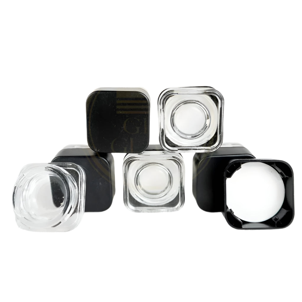 Shop Clear Glass Dab Jars with Black Cap in bulk—airtight, durable storage for concentrates. Perfect for cannabis accessories wholesale and smoking supply distributors.