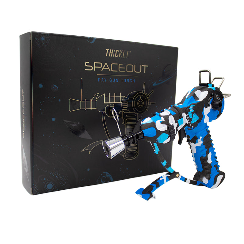 Get the THICKET SPACEOUT - CAMO RAYGUN Torch Lighter in bulk! A top-selling novelty with real performance, perfect for cannabis accessories wholesale and smoke shops.