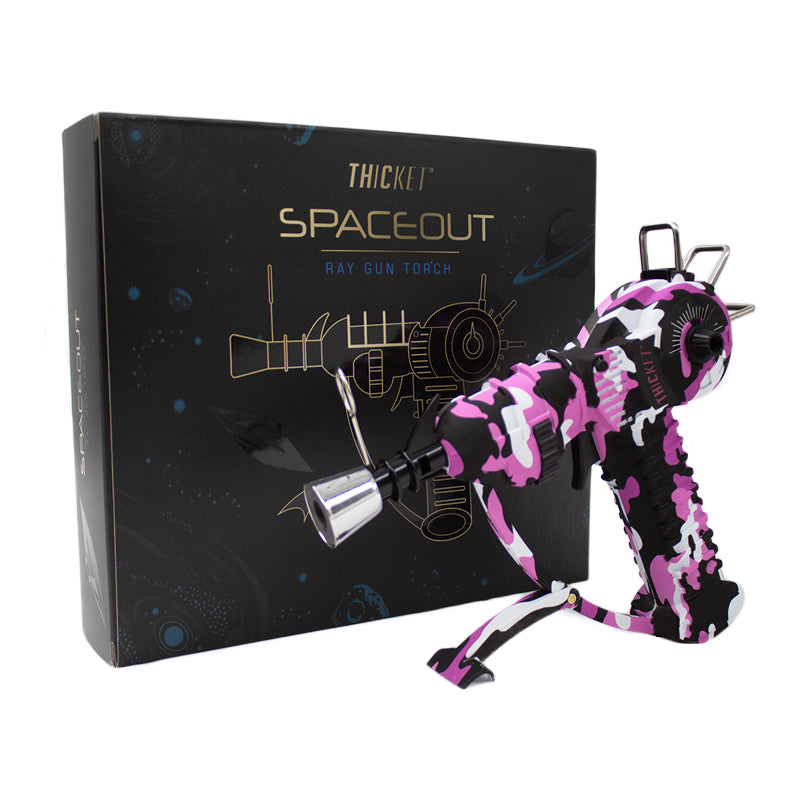 Get the THICKET SPACEOUT - CAMO RAYGUN Torch Lighter in bulk! A top-selling novelty with real performance, perfect for cannabis accessories wholesale and smoke shops.