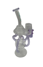 Close-up of King Pluto Dual Tone Recycler Dab Rig with intricate glasswork and looped recycler arms.

