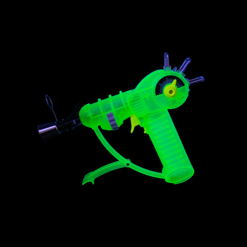 Get the THICKET SPACEOUT Raygun Glow in the Dark Torch in assorted colors – a top pick for wholesale cannabis accessories and bulk smoking supplies. Perfect for California smoke shops.