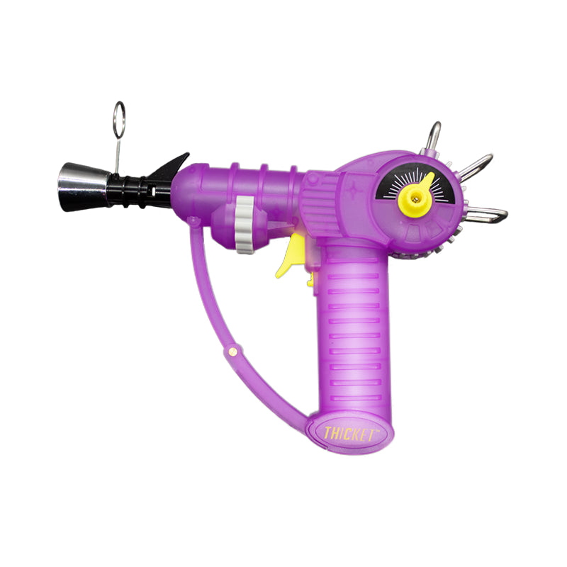 Get the THICKET SPACEOUT Raygun Glow in the Dark Torch in assorted colors – a top pick for wholesale cannabis accessories and bulk smoking supplies. Perfect for California smoke shops.