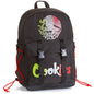 A black backpack featuring a large embroidered Mexican flag eagle graphic on the upper front and the word 'Cookies' in green, white, and red across the lower front pocket. The backpack has two black buckle straps on the front pocket and red drawstring side cords.