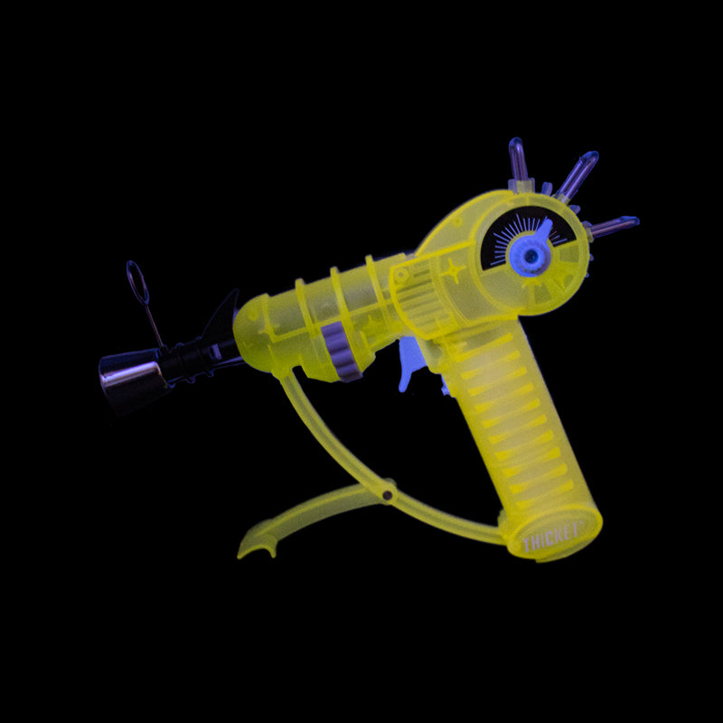 Get the THICKET SPACEOUT Raygun Glow in the Dark Torch in assorted colors – a top pick for wholesale cannabis accessories and bulk smoking supplies. Perfect for California smoke shops.