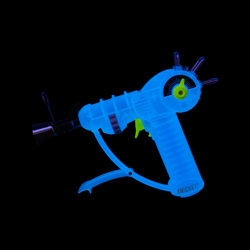 Get the THICKET SPACEOUT Raygun Glow in the Dark Torch in assorted colors – a top pick for wholesale cannabis accessories and bulk smoking supplies. Perfect for California smoke shops.