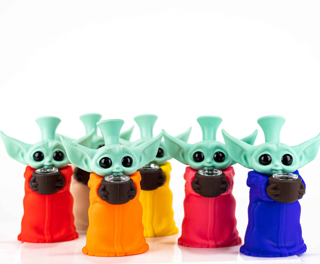 Wholesale display case containing multiple Star Alien Baby Yoda bongs.