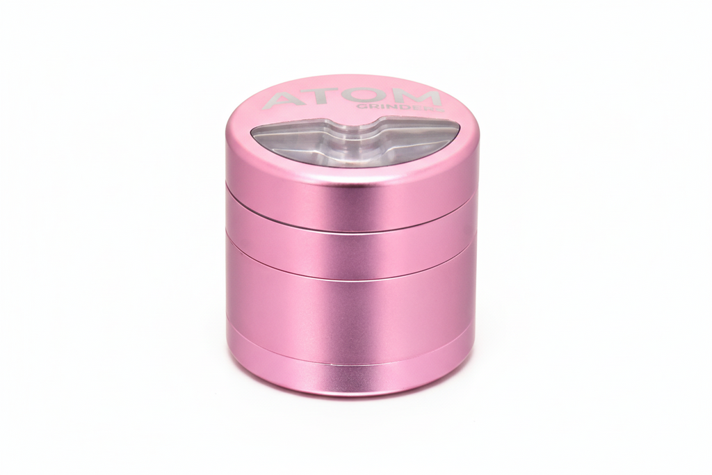 Top view of ATOM Half Moon grinder showing durable metal construction