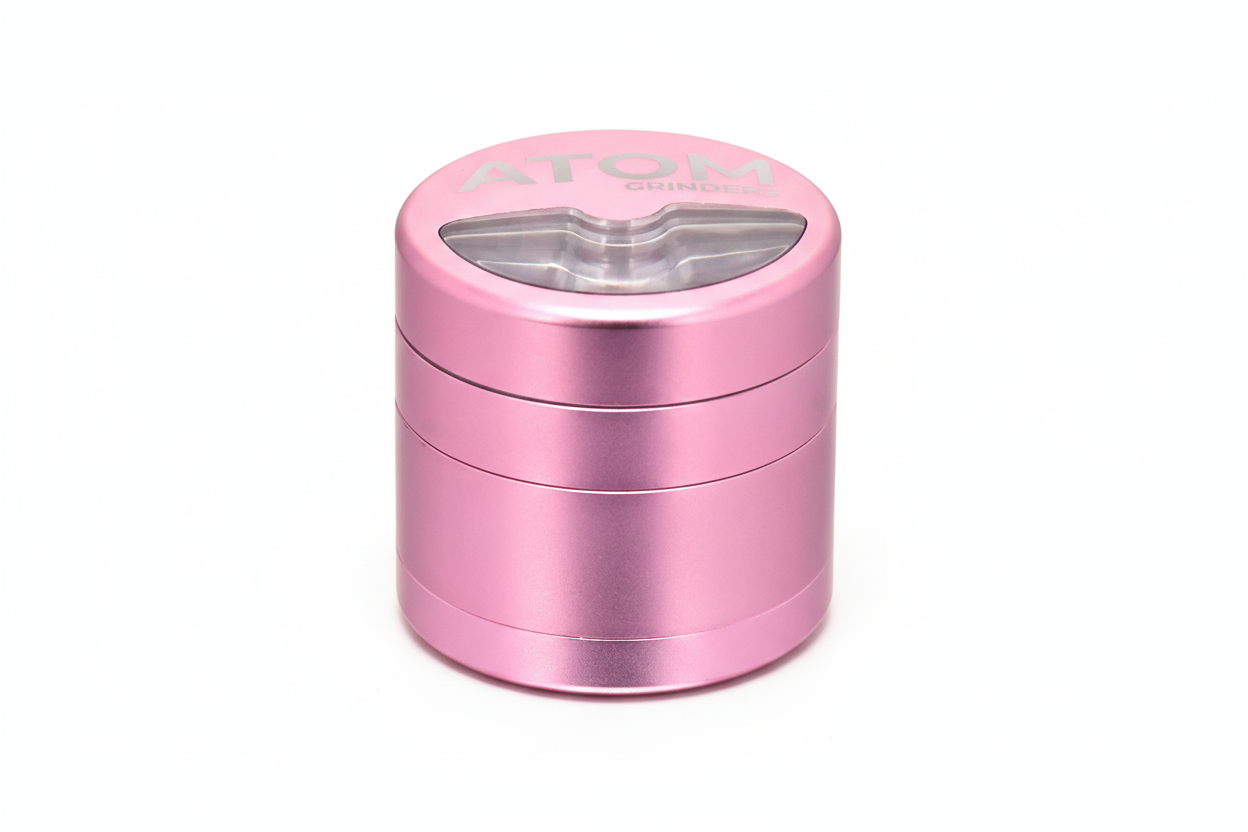 Top view of ATOM Half Moon grinder showing durable metal construction