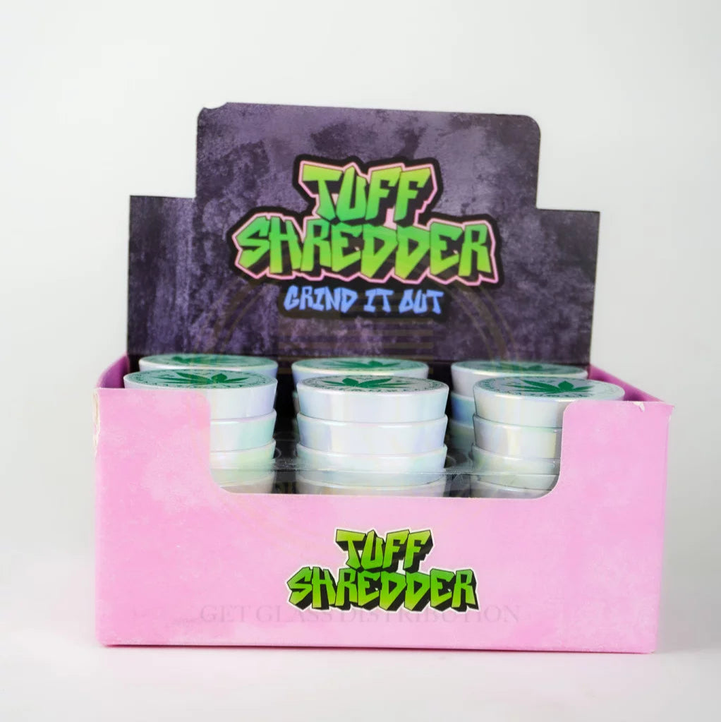 Shop the Tuff Shredder 45MM Iridescent 4-Piece Grinder with Ashtray – top-rated wholesale cannabis accessory with a weed print design and built-in ashtray.