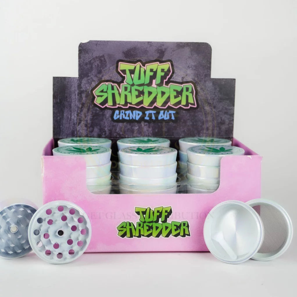 Shop the Tuff Shredder 45MM Iridescent 4-Piece Grinder with Ashtray – top-rated wholesale cannabis accessory with a weed print design and built-in ashtray.